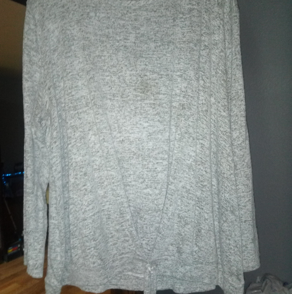 Super soft 1x sweater ties in front at bottom